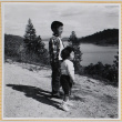 William and Susan Shiomi on hill overlooking water (ddr-densho-522-299)