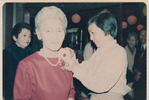 Mitsuye Yabe Getting Corsage Pinned (ddr-ohs-1-270)
