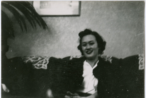 Woman seated on couch (ddr-densho-329-807)