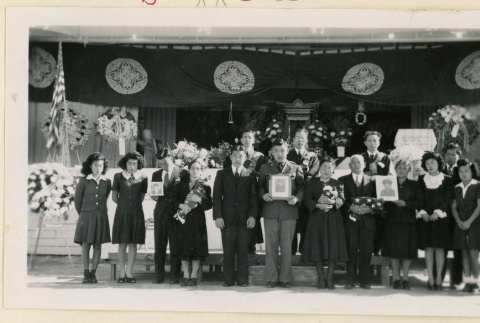 Family at memorial service for soldiers (ddr-densho-37-1786)