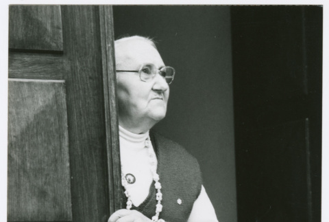 Woman looking out of doorway (ddr-densho-1007-275)