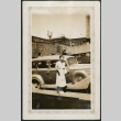 Woman poses with car (ddr-densho-359-937)