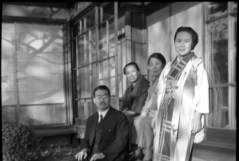 Man and three women outside building (ddr-densho-426-301)