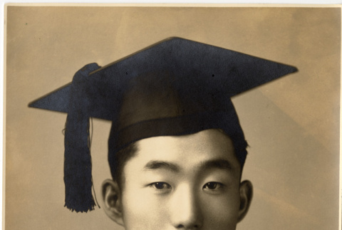 Portrait on Harry Miwa in graduation robe (ddr-densho-587-102)