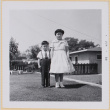 Girl and boy standing in yard (ddr-densho-522-491)