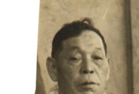 Man wearing leis (ddr-njpa-4-207)