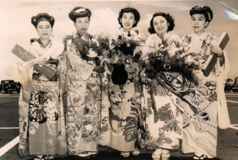Women in kimono holding flowers (ddr-njpa-4-869)