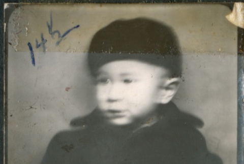 Baby in black hat and coat (ddr-densho-483-600)