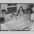 Japanese Americans eating in a mess hall (ddr-densho-37-482)