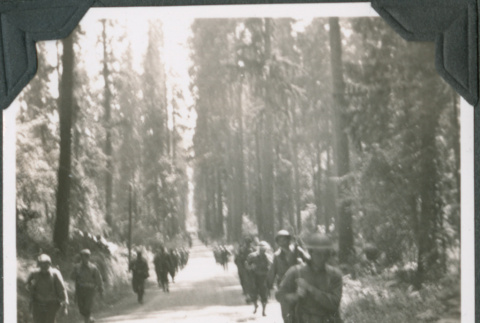 Group of men marching along road (ddr-ajah-2-227)