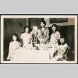 Five girls around table with decorations (ddr-densho-293-112)
