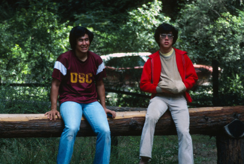 Cary Matsumura and Kyle Kashima sitting on a log (ddr-densho-336-1305)