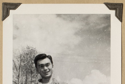 Lloyd Sato with arms crossed (ddr-densho-542-476)