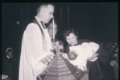 Priest baptizing a child (ddr-densho-330-226)