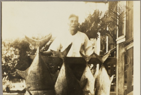 Toyozo Hirayama with fish (ddr-njpa-5-1251)