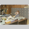 Man in office with feet on desk (ddr-densho-426-144)