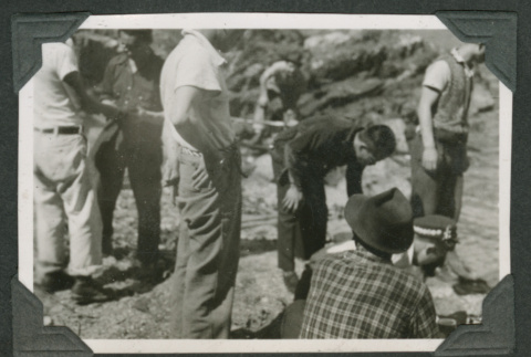 Group of men waiting (ddr-densho-540-67)