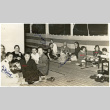 Group eating Sukiyaki dinner on a ship (ddr-densho-494-18)