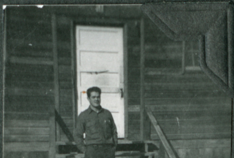 Man standing on stairs of barracks (ddr-ajah-2-294)