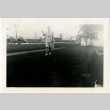 Woman standing in camp administration area (ddr-manz-7-118)