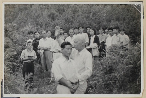 Group witness a baptism (ddr-densho-433-733)
