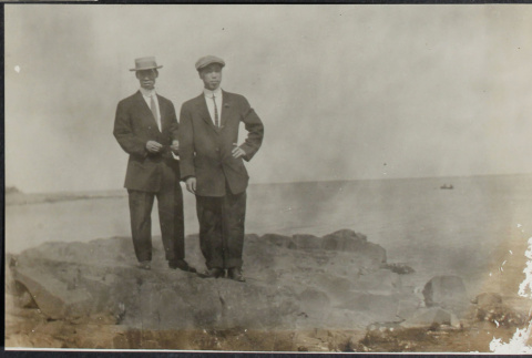 Two men standing on shore (ddr-densho-355-621)