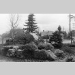 Stones and plantings on corner of Renton Ave and 55th, looking toward houses across the street (ddr-densho-354-1494)