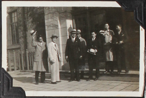 Group of 7 men standing in front of building (ddr-densho-326-342)