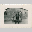 Three women, three children and a dog outside barn (ddr-densho-523-687)