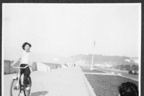 Wakako riding a bicycle (ddr-densho-443-53)