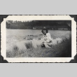 Woman by edge of pond with ducks (ddr-densho-466-930)