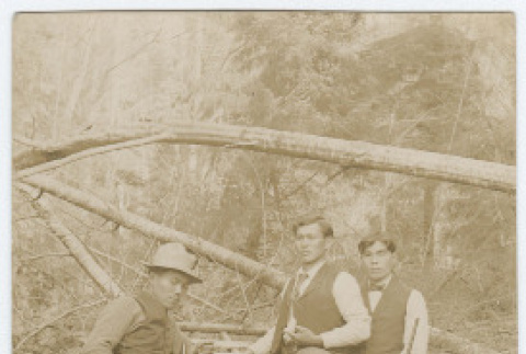 Postcard photograph of four men with rifles (ddr-densho-383-428)