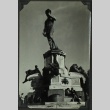 People sitting around base of a statue (ddr-densho-201-264)