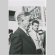Man standing at microphone (ddr-densho-426-1046)