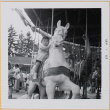 Leslie Shiomi on Merry-go-round (ddr-densho-522-446)