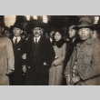Ikuo Oyama and his wife being led through a crowd under guard (ddr-njpa-4-1664)