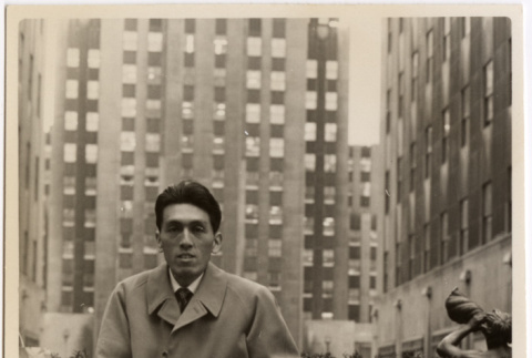 Man seated in front of building (ddr-densho-426-83)