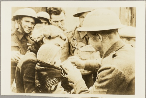 Soldiers helping a woman with her baby (ddr-njpa-13-304)