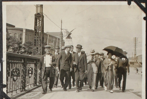 Group of men walking on street (ddr-densho-326-104)