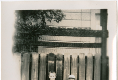 Two boys standing by fence (ddr-densho-426-1132)