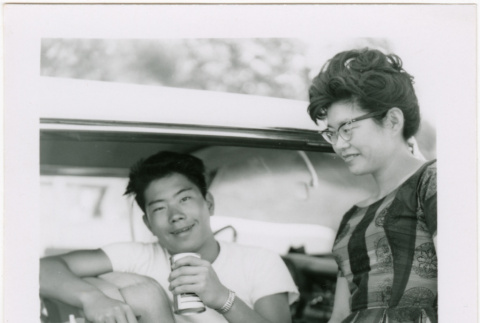 Tomoye (Nozawa) Takahashi and Norman Takahashi by car (ddr-densho-426-2201)
