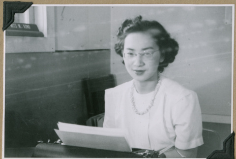 Woman working on typewriter (ddr-densho-397-56)
