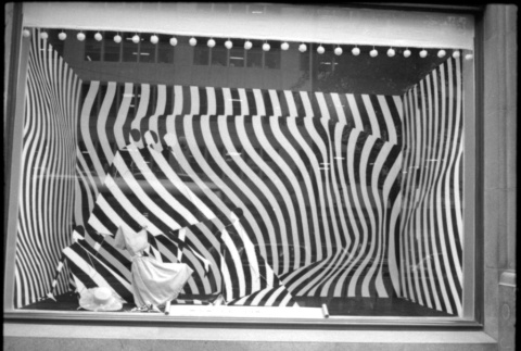 Large window display with dark striped background (ddr-densho-426-2291)