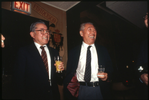 Two men laughing with drinks (ddr-densho-1007-740)