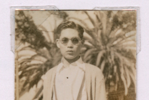 Takeo Isoshima in front of palm trees (ddr-densho-477-26)