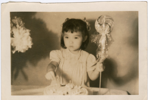 Child holding lollipop (ddr-densho-430-285)