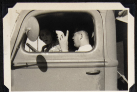Two people in a truck (ddr-densho-542-766)