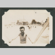 Man exiting swimming pool (ddr-densho-545-41)