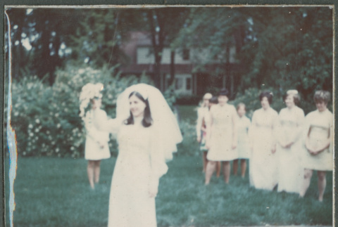 Bride throwing bouquet (ddr-densho-523-524)