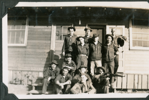 12 men on steps outside barracks (ddr-ajah-2-55)